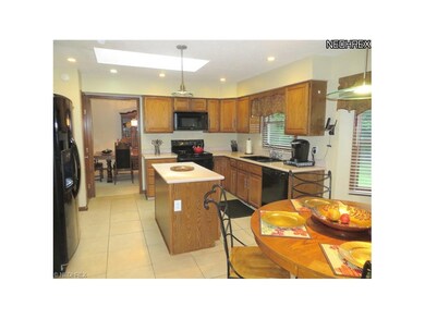 Oak Kitchen w/Travatine Tile Floor. Island. Corien