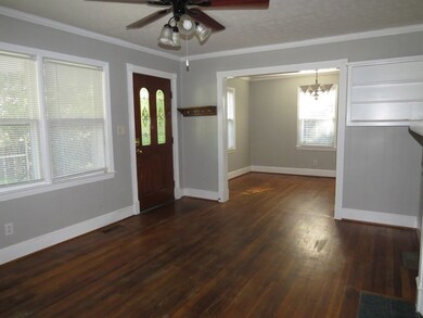 Living room with view of dining room