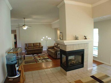 Living Room. Hdwd Floors in LR, FamRm  w/Tile Floors  2 sided Gas Fp Separates for cozy feel