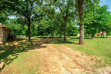 Large one acre lot with sand and plenty of parking
