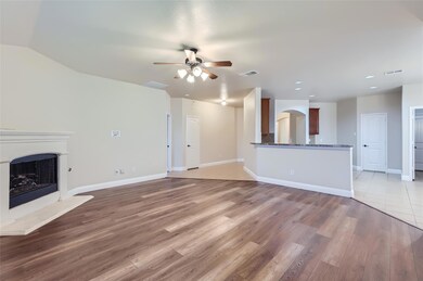 Unfurnished living room with tile floors and ceili
