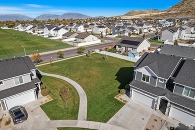 Aerial perspective of suburban area with a mountainous background
