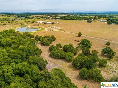 South of property, looking NW at tank, homes and pasture