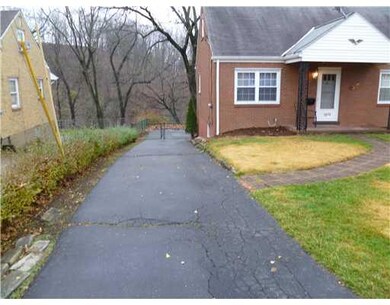 Exterior Front. Long driveway that leads to rear g
