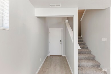 Staircase featuring wood finished floors and baseboards