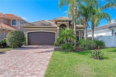 Front Home Elevation featuring a garage and a fron