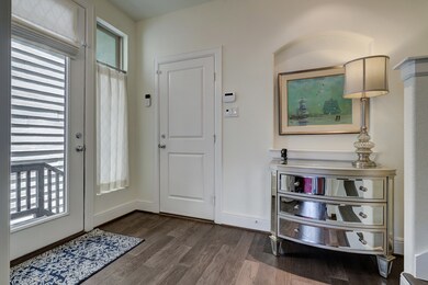 The inviting entry has access to the front door an