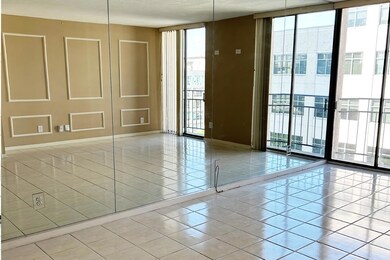 Spare room with floor to ceiling windows and ligh