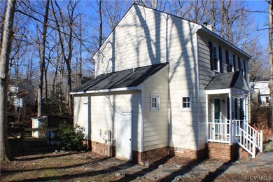 View of the side of the home with the attached she
