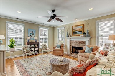 Lovely living room with wood burning fireplace whi