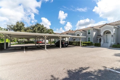 View of parking / parking lot featuring a carport