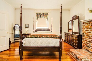 Main Level Bedroom -note brick fireplace-