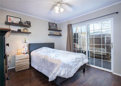 Bedroom featuring crown molding, hardwood / wood-