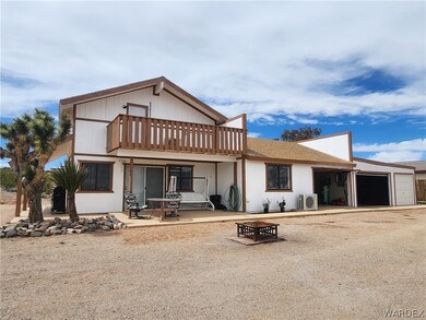 View of front of property with a garage with three