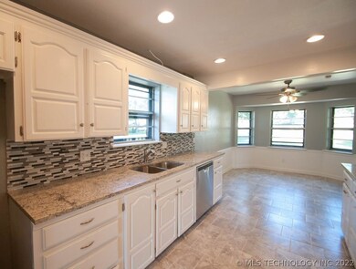 Kitchen has a lot of counter space and cabinets.