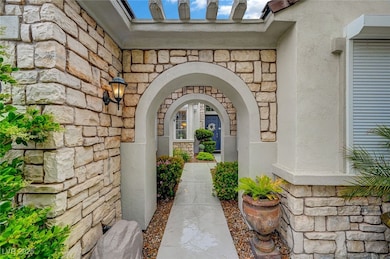 Doorway to property with stone siding