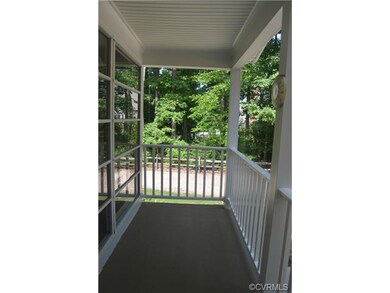 Side porch with access to sunroom.