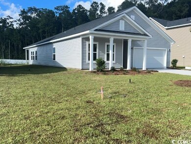 View of front of property with a garage and a fron