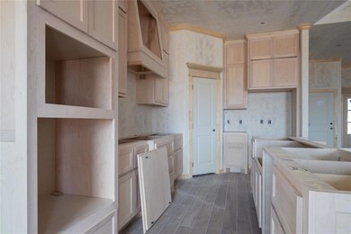 Kitchen with dark hardwood / wood-style flooring, 