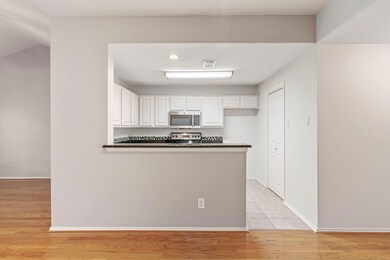 Kitchen featuring electric stove, kitchen peninsul