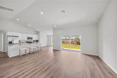 Living room with light wood-type flooring, visible