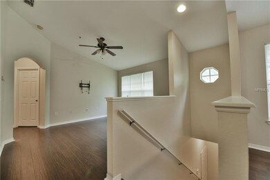 Staircase leading up to this second story condo