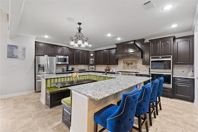Step into a chef’s dream kitchen featuring granite