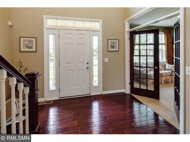 The entry area features a dramatic 2-story vaulted