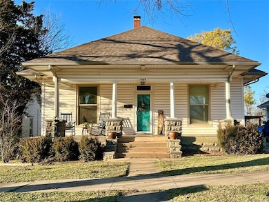 Bungalow-style home with covered porch, a shingled