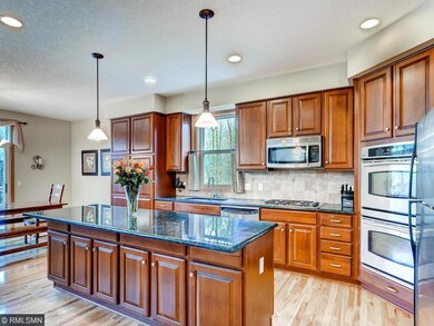 Kitchen features granite counter tops and large am