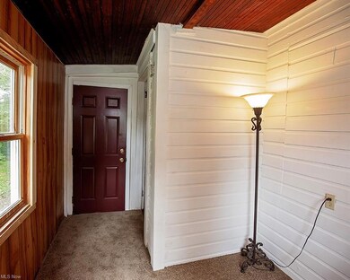 Cute foyer provides a small retreat.