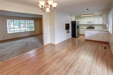 dining area looking into kitchen and living room