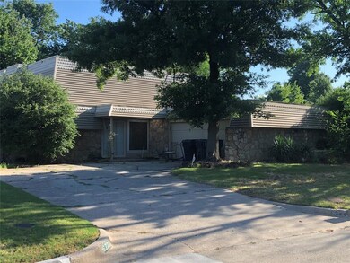 Single story home featuring a front lawn