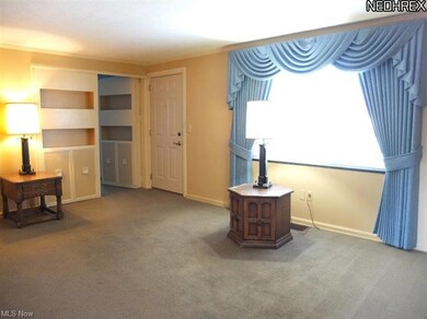 Living room with built in shelves.