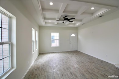 Entrance foyer featuring beam ceiling, wood finished floors, coffered ceiling, recessed lighting, and ceiling fan