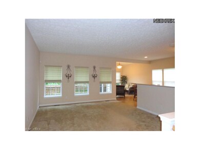 And leads to the great room with custom blinds, ne