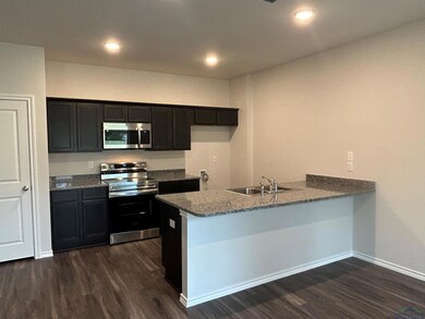 Kitchen featuring stainless steel appliances, sink