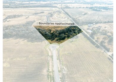 Aerial view of sparsely populated area featuring property boundaries highlighted
