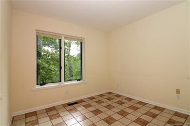 Cozy sitting/TV room off of kitchen, living, and d