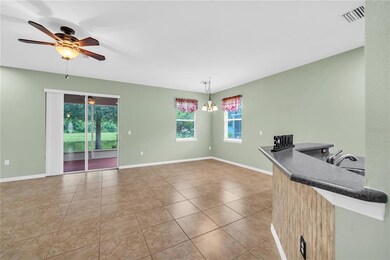ENTRY INTO GREAT ROOM WITH TILE FLOORING AND CEILI