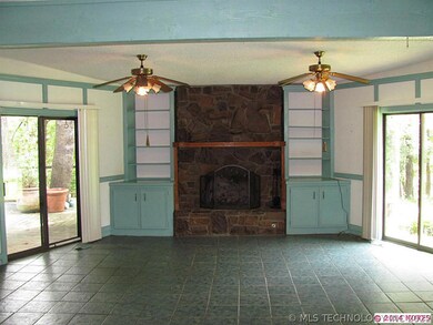 Living area with gas starter firplace, built ins a