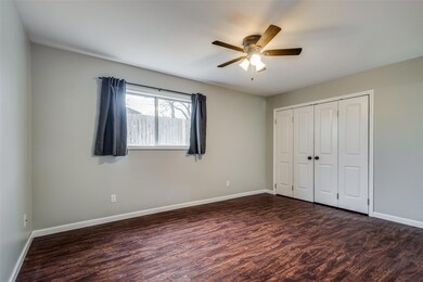 Unfurnished bedroom with a closet, ceiling fan, an