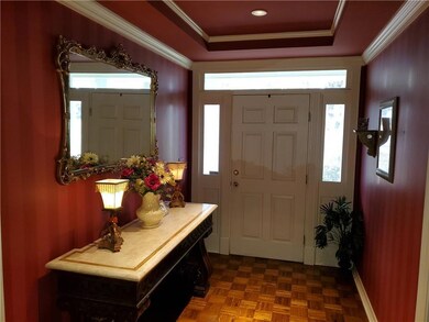 Tray ceiling foyer opens into this spacious home