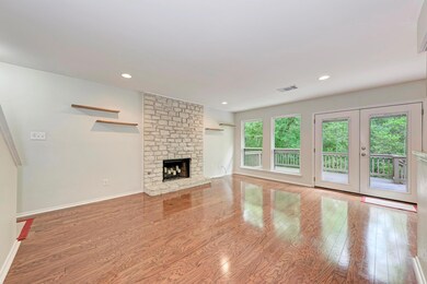 Unfurnished living room featuring visible vents, 