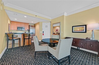 Dining area with recessed lighting, dark carpet, and ornamental molding