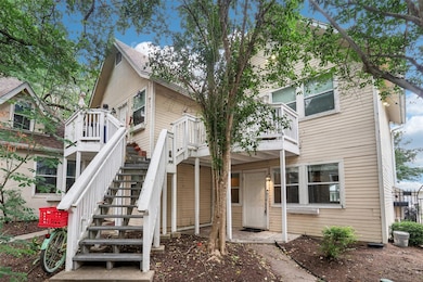 View of property with stairway and a deck