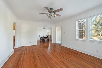 Unfurnished room with ceiling fan with notable cha