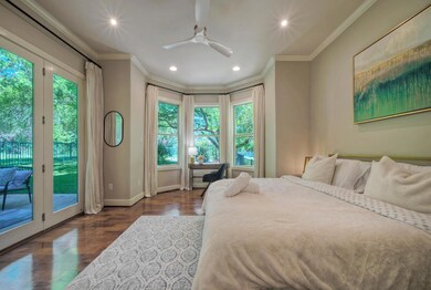 Bedroom with access to outside, baseboards, ornam