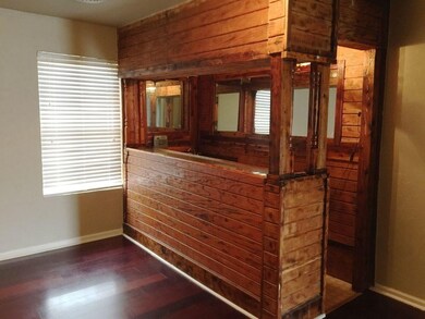An area with a wet bar, connected to the living ro