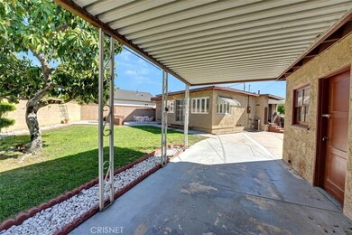 COVERED CARPORT ADJACENT TO 2 CAR GARAGE